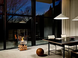 EcoSmart Fire Ghost Designer Fireplace brings modern ethanol heating to a private residence dining room in Japan with a sleek freestanding design.